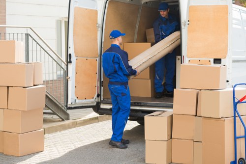Moving van and packing boxes representing transparent man and van Haringey pricing