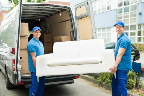 Moving furniture carefully in a Haringey residential street