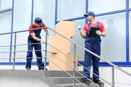 Team preparing a safe moving operation with careful lifting and loading