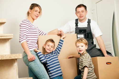 Packed moving boxes and furniture ready for transport in Haringey