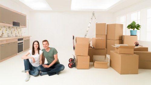 Professional removal team loading furniture for a North London move