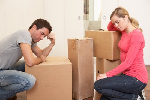 Worker wearing PPE while moving furniture safely